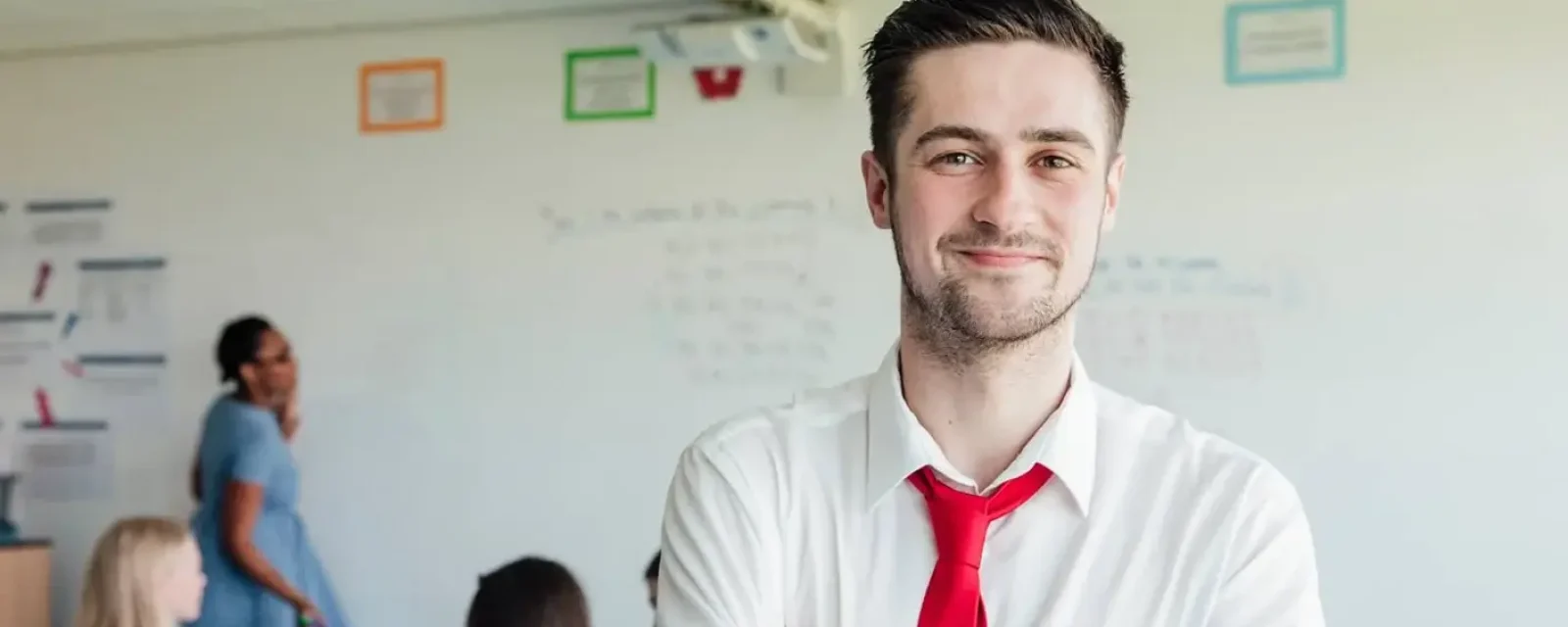 An aspiring manager smiling at the camera