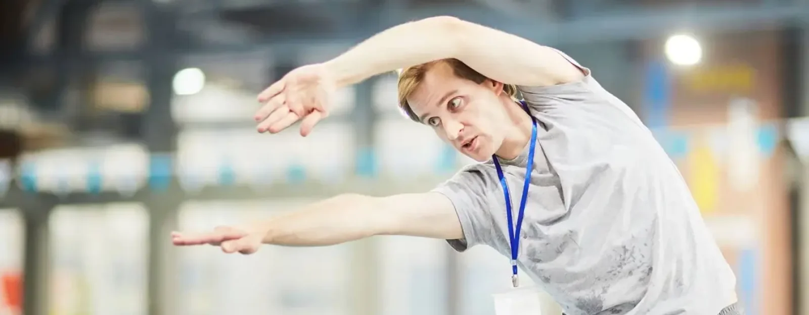 An assistant swimming teacher showcasing a stroke method